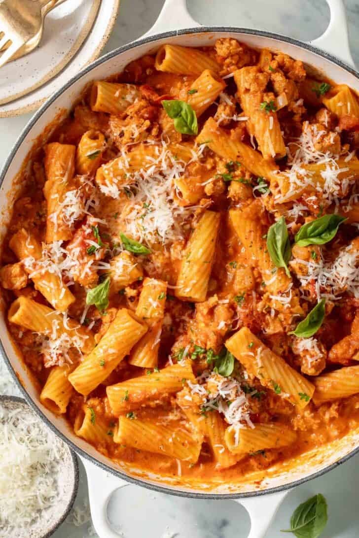 Sausage Rigatoni Sausage Rigatoni in a white skillet.