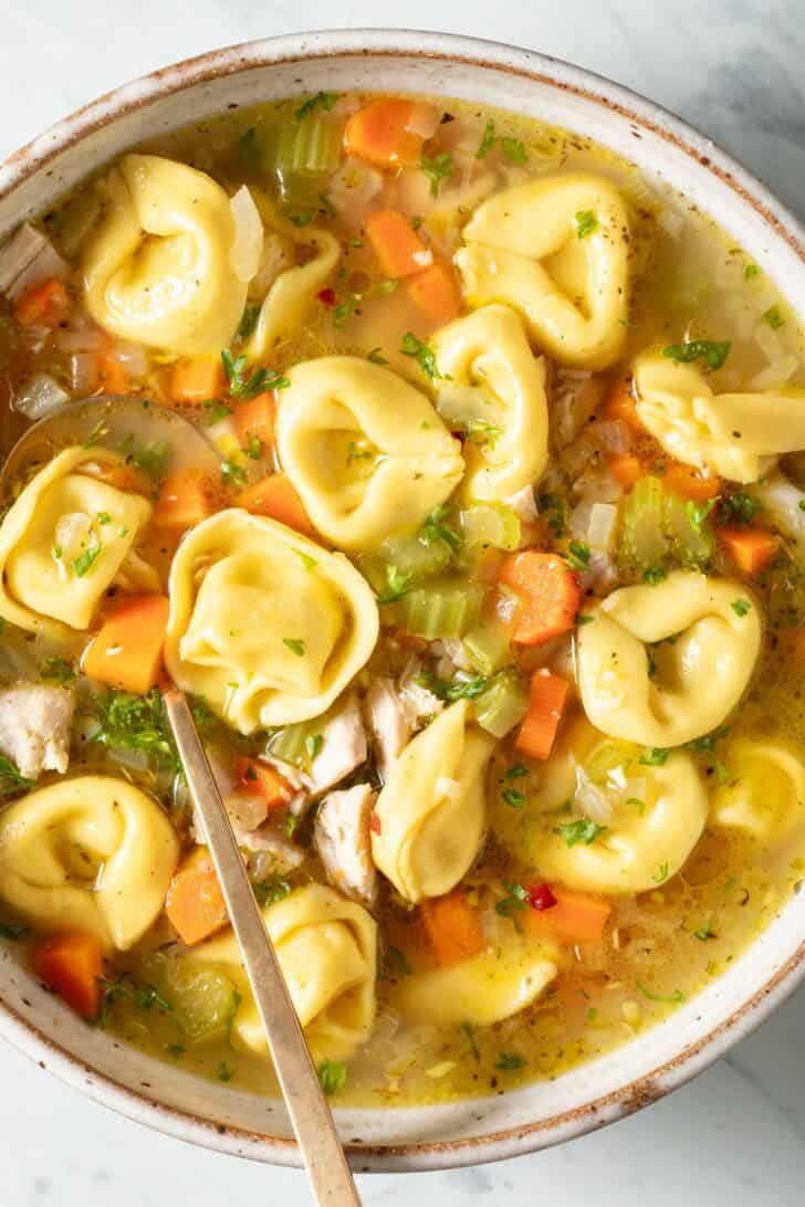 Easy Chicken Tortellini Soup Easy Chicken Tortellini Soup in a bowl with a spoon.