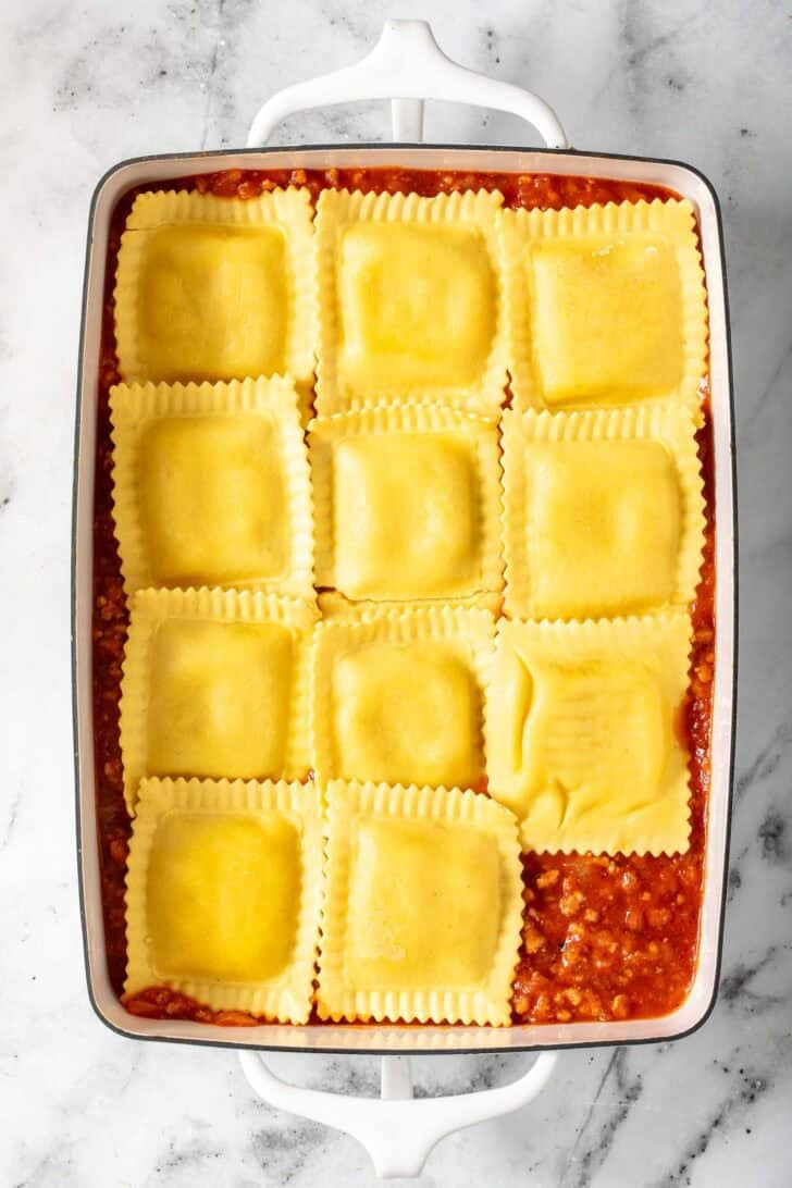 Baked Ravioli Lasagna Baked Ravioli Lasagna in a white baking dish.