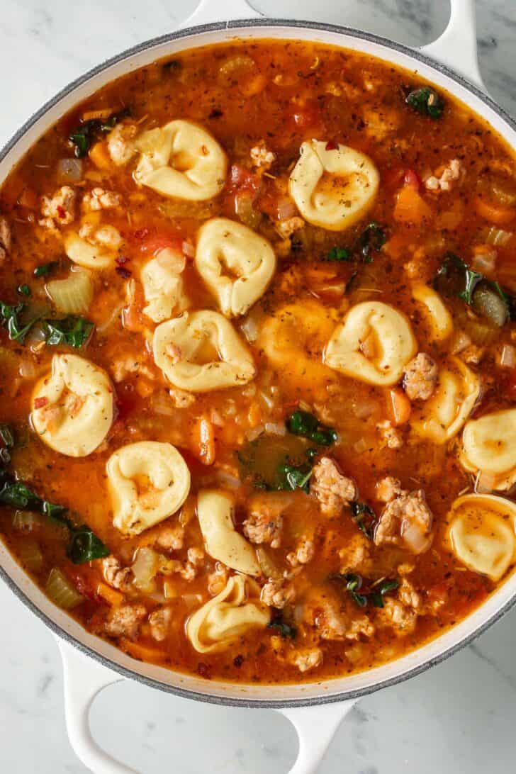 Italian Sausage Tortellini Soup Italian Sausage Tortellini Soup in a white pot.