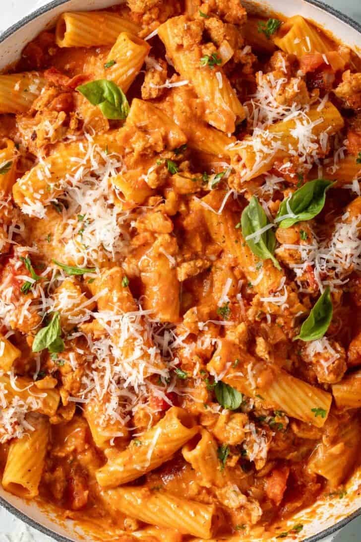 Creamy Italian Sausage Pasta Creamy Italian Sausage Pasta in a white skillet.