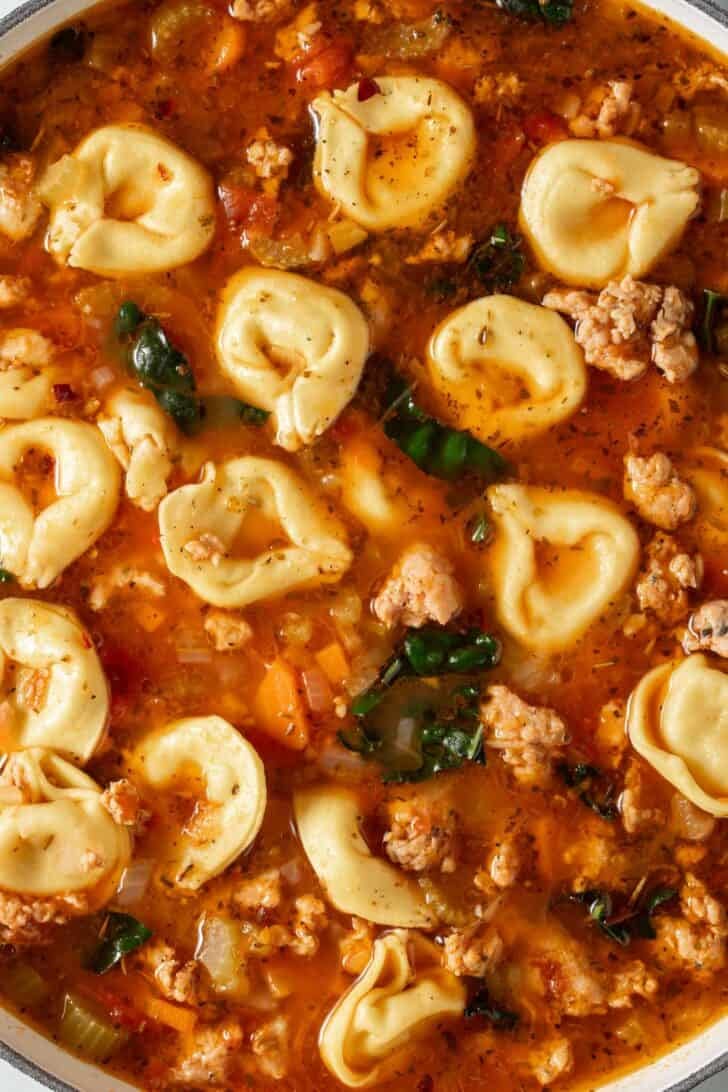 Sausage and Tortellini Soup Sausage and Tortellini Soup in a white pot.