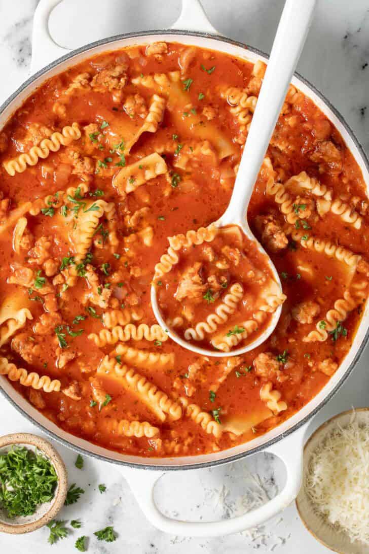 Best Lasagna Soup Lasagna Soup in a white pot with a white ladle.