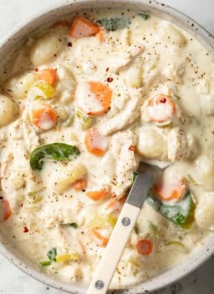 Chicken Gnocchi Soup in a bowl with a spoon.