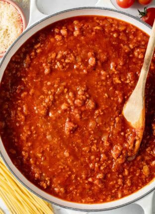 Homemade Spaghetti Sauce in a white Dutch oven.