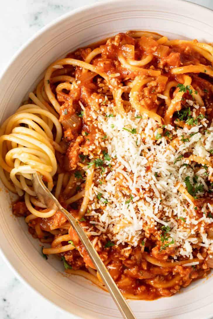 Homemade Spaghetti Sauce Spaghetti Sauce over spaghetti noodles in a white bowl.