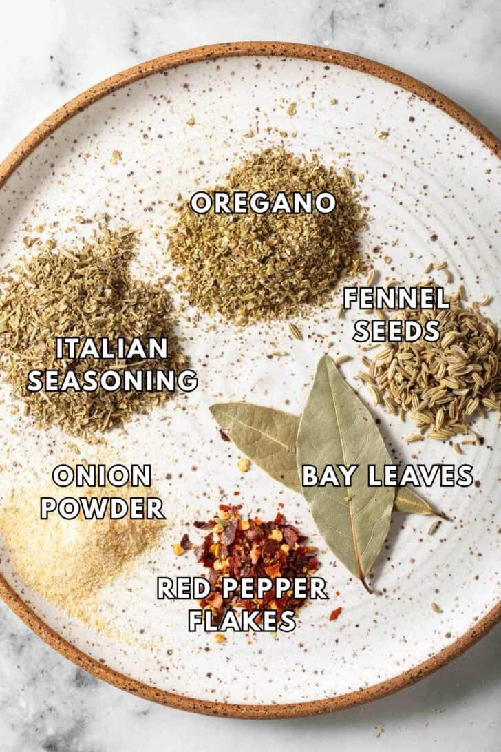 Seasoning for Spaghetti Sauce Seasoning for spaghetti sauce on a plate (Italian seasoning, oregano, fennel seeds, onion powder and red pepper flakes).