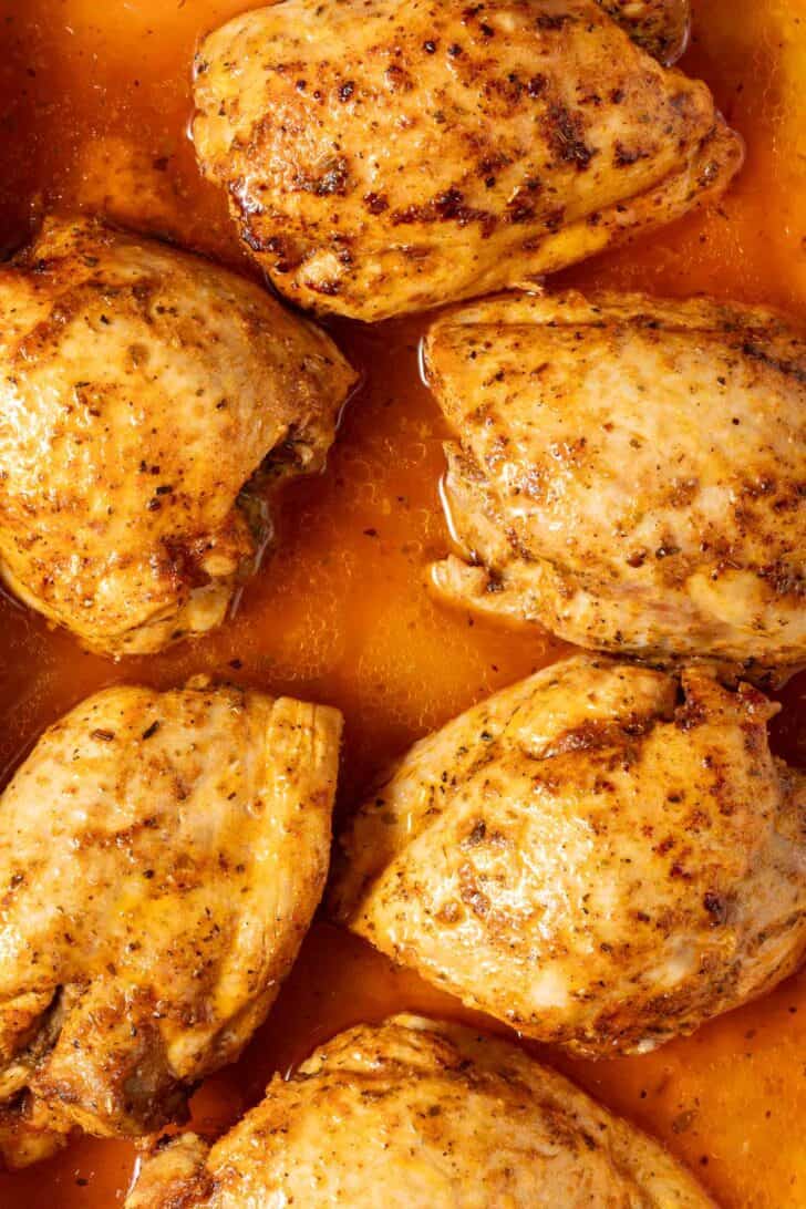 Baked Boneless Skinless Chicken Thighs Baked Boneless Skinless Chicken Thighs in a baking dish.