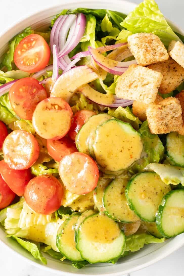 Italian Vinaigrette Sewaainf Salad tossed with Italian vinaigrette dressing in a bowl.