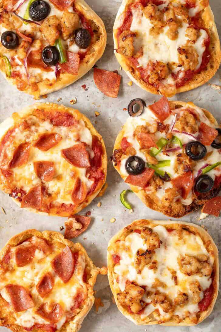 English Muffin Pizza English Muffin Pizzas on a baking sheet.