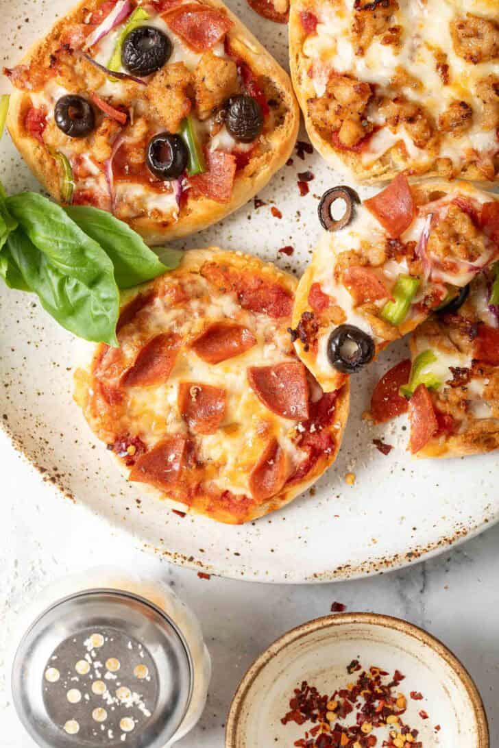 English Muffin Pizza English Muffin Pizzas on a plate.