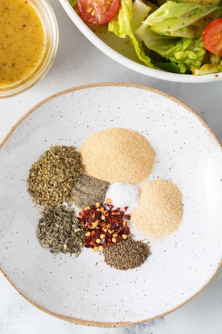 Italian Dressing Mix Homemade Italian Dressing Mix seasonings measured in a small white dish.