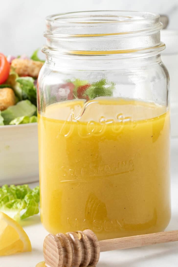 Honey Vinaigrette Dressing Honey Vinaigrette Dressing in a clear glass mason jar.