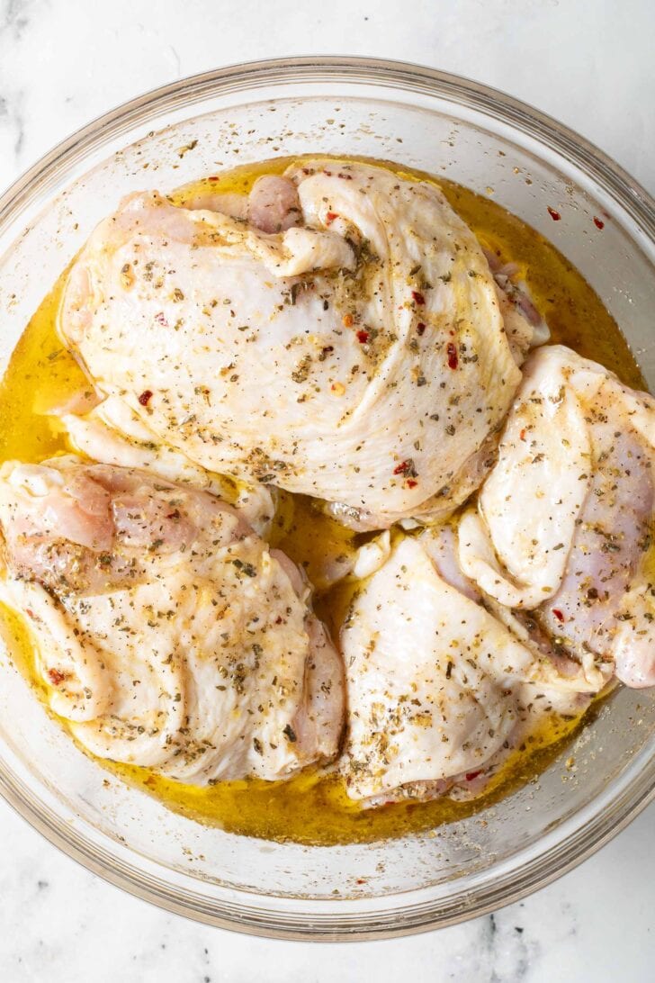 Italian Dressing Marinated Chicken Chicken marinating in Italian salad dressing.
