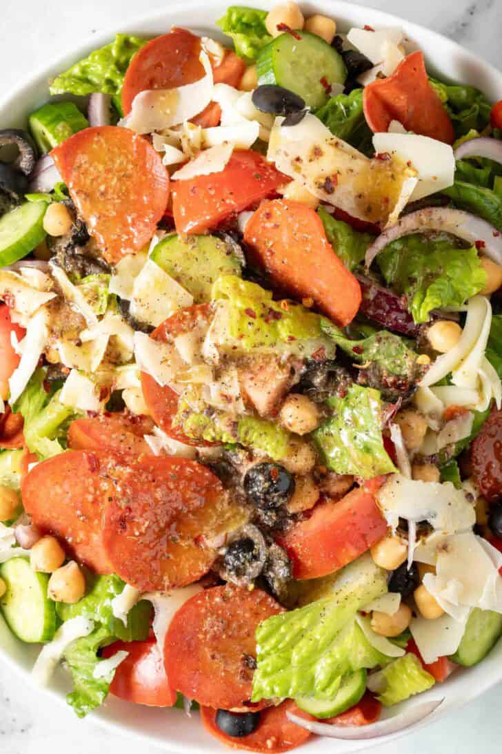 Pizza Salad in a white bowl. Pizza Salad