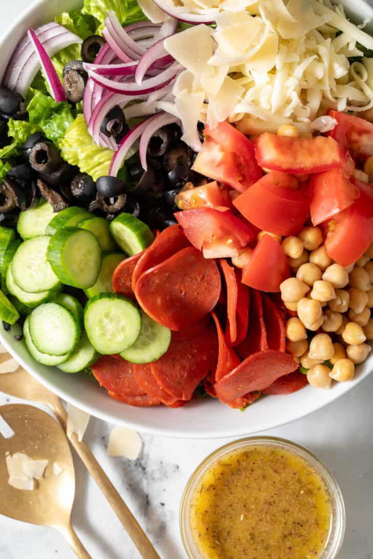 Recipe for Pizza Salad Pizza Salad in a white bowl.