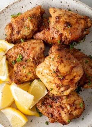 Crispy Air Fryer Chicken Thighs on a plate.