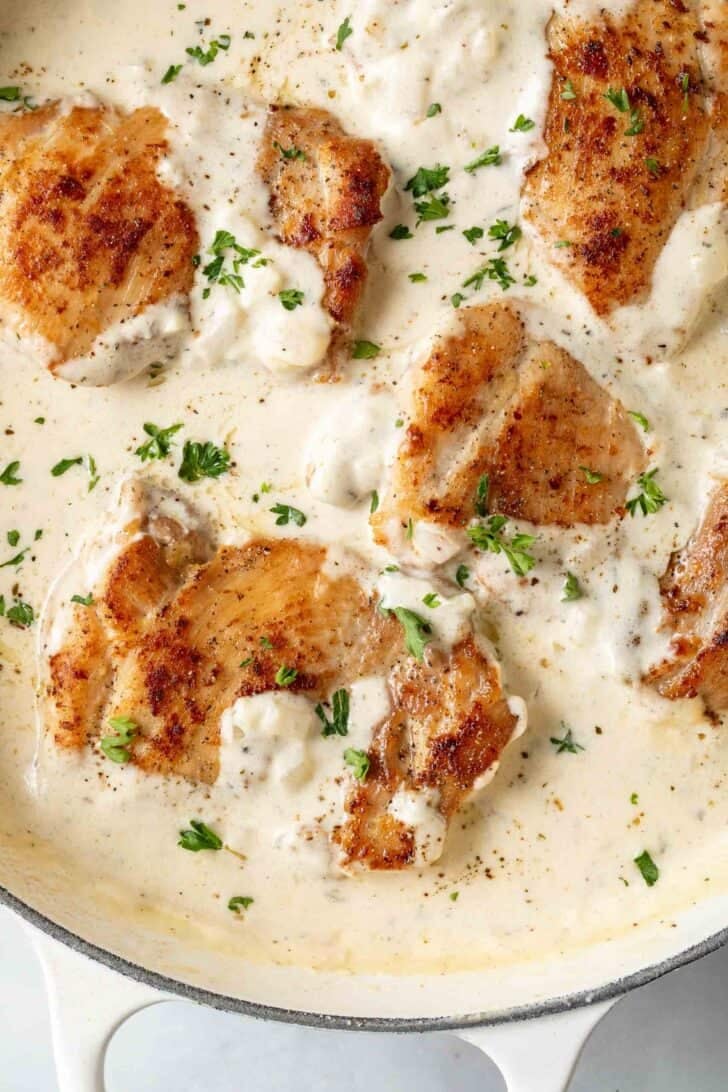 Boursin Chicken in a white skillet.