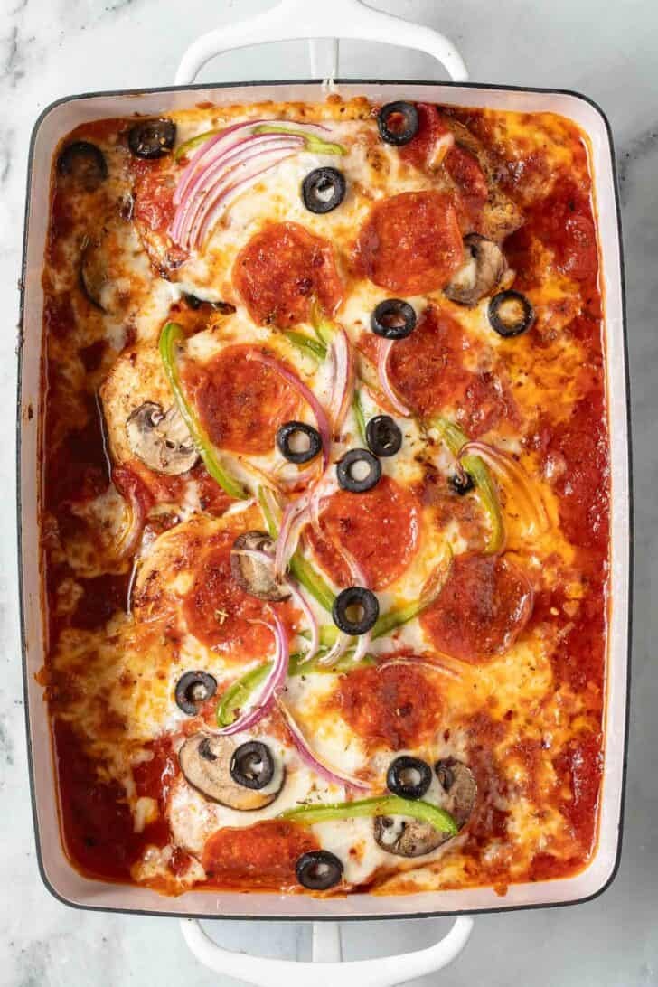 Pizza Baked Chicken Pizza Baked Chicken in a white baking dish.