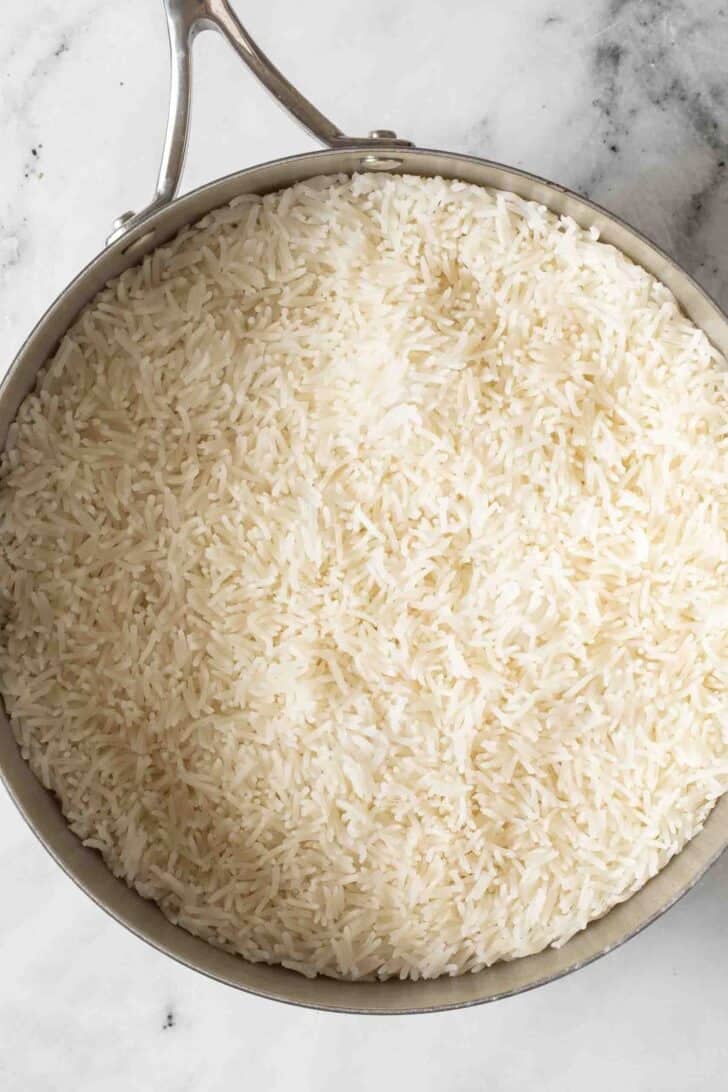 Cooking Basmati Rice Cooked basmati rice in a saucepan.
