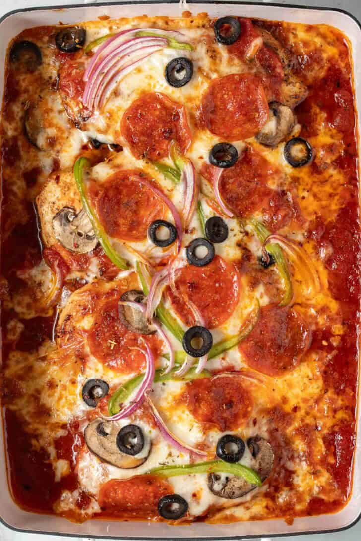 Pizza Chicken Bake Pizza Chicken Bake in a white baking dish.