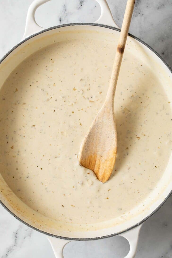 Boursin cream sauce in a white skillet.