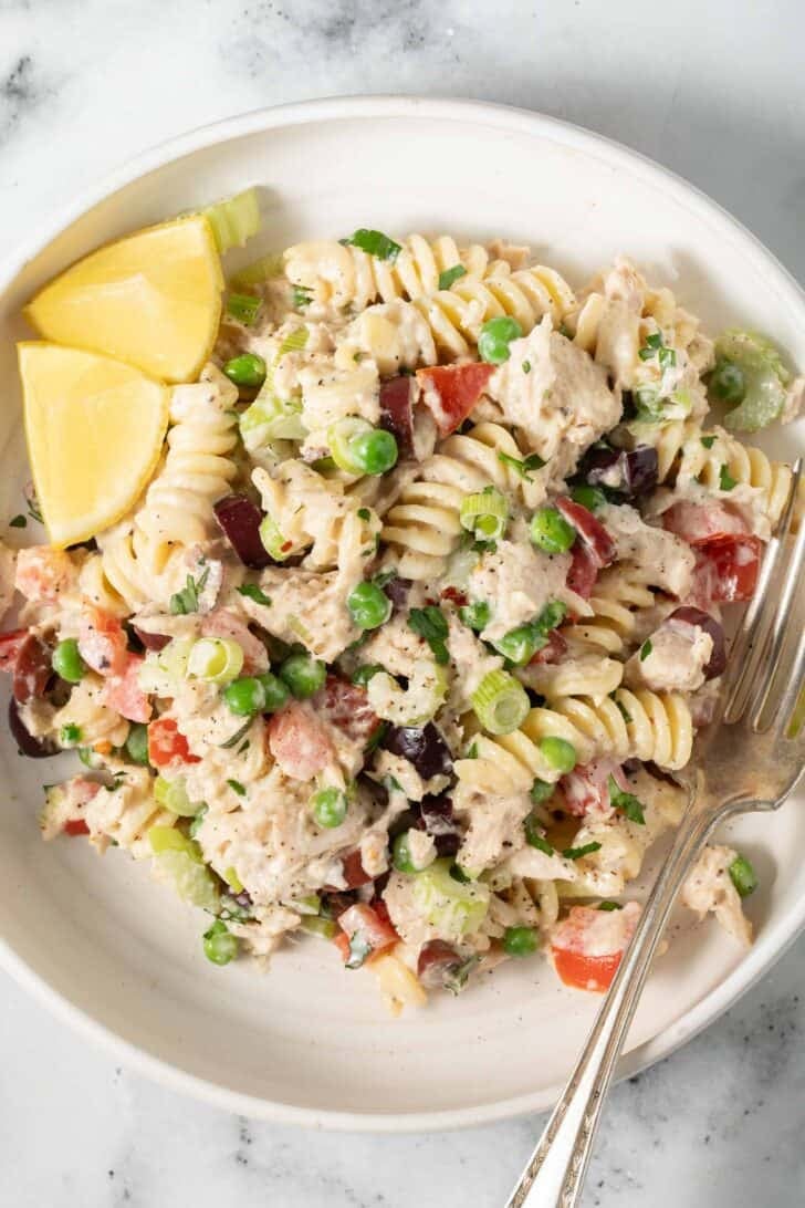 Pasta Tuna Salad Pasta Tuna Salad in a white bowl with a fork.