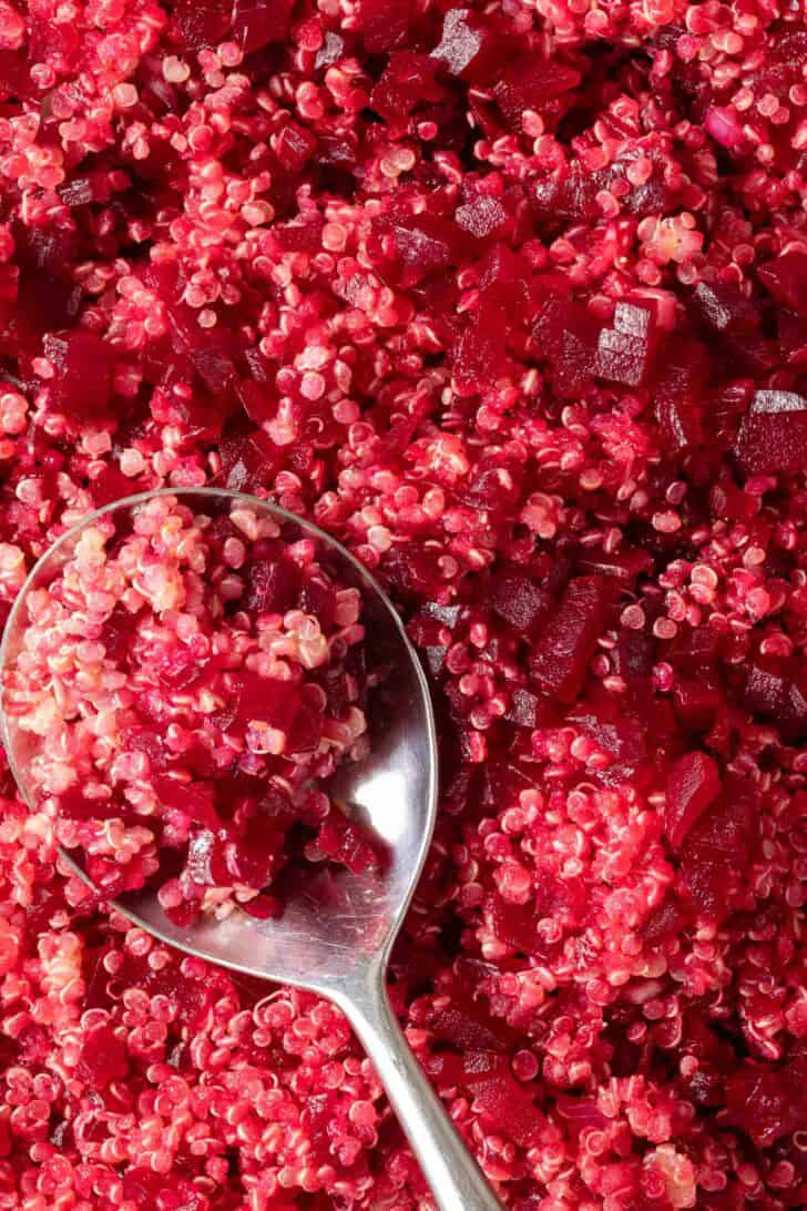 Beets and Quinoa Beets and Quinoa in a bowl with a spoon.
