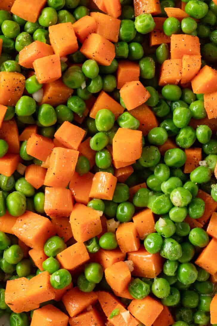 Frozen Peas and Carrots Frozen Peas and Carrots in a white skillet.