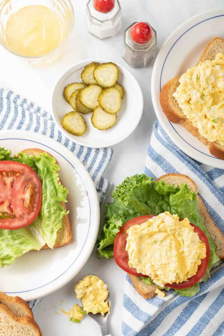How to Make Egg Salad Sandwich Egg Salad on tomato slices and bread for egg salad sandwich.