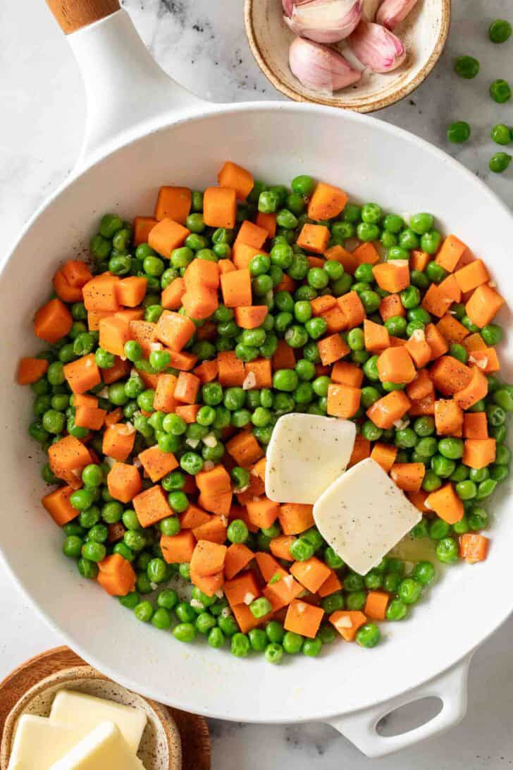 Carrots and Peas Peas and Carrots in a white skillet.