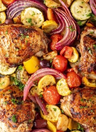 Greek Sheet Pan Chicken on a baking sheet.