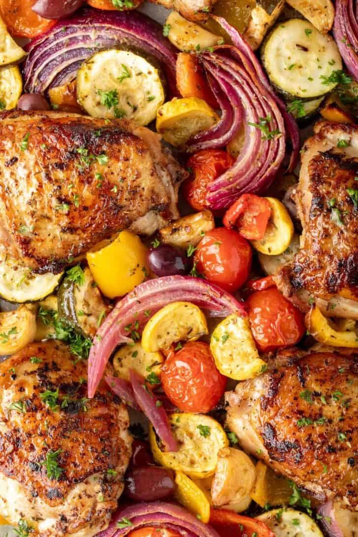 Sheet Pan Greek Chicken Sheet Pan Greek Chicken and Vegetables on a baking tray.