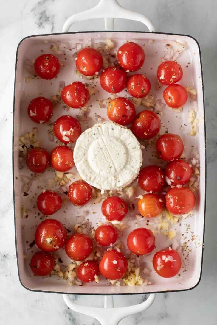 Boursin Pasta Recipe Boursin Cheese, garlic and cherry tomatoes in a baking dish.