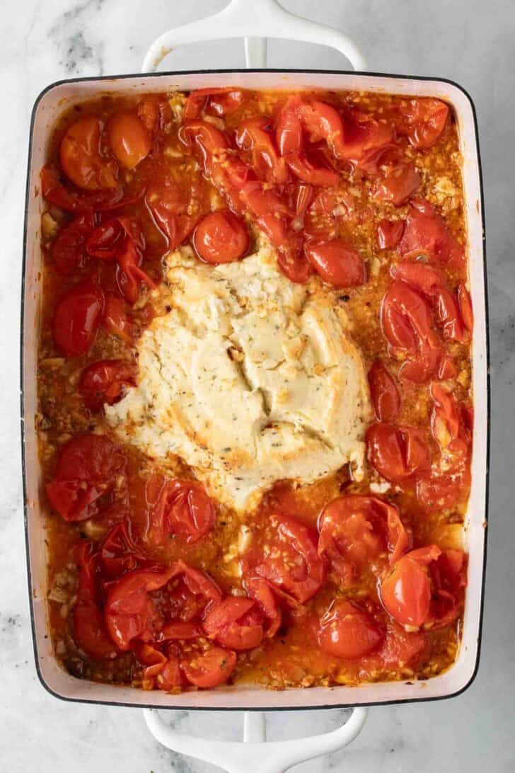 Boursin Tomato Pasta Boursin Cheese with cherry tomatoes in a baking dish.