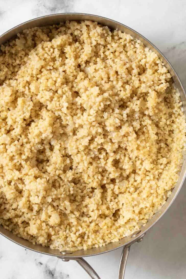 How to Season Quinoa Cooked seasoned quinoa in a pot.