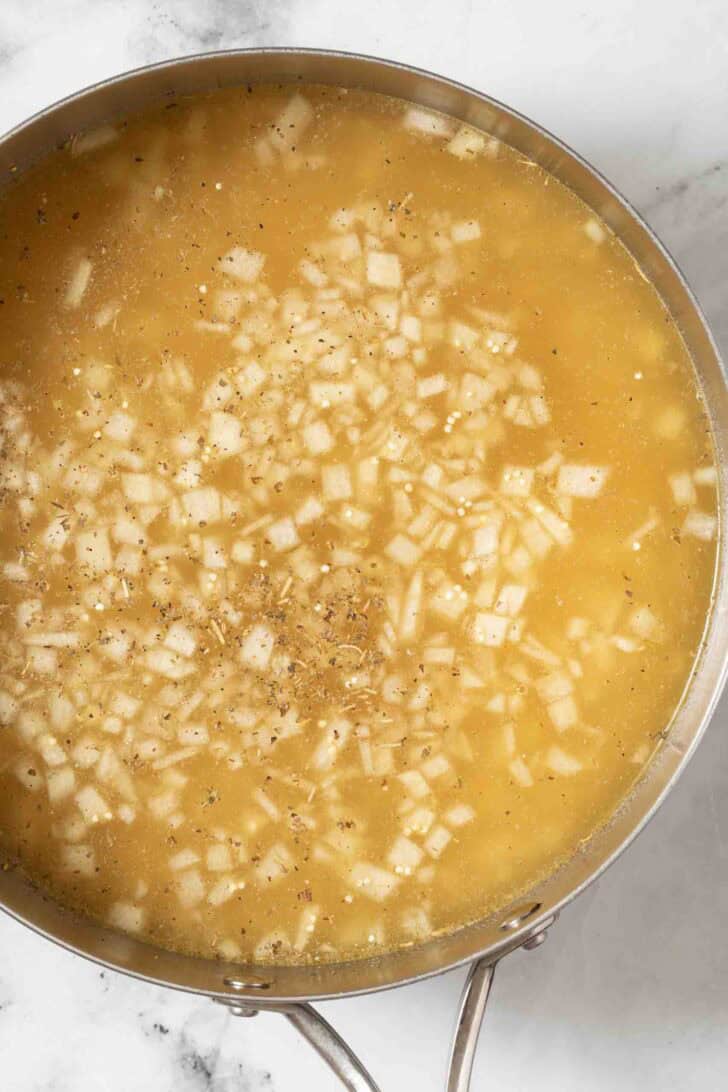 How to Add Flavor to Quinoa Seasoned Quinoa in a pot.