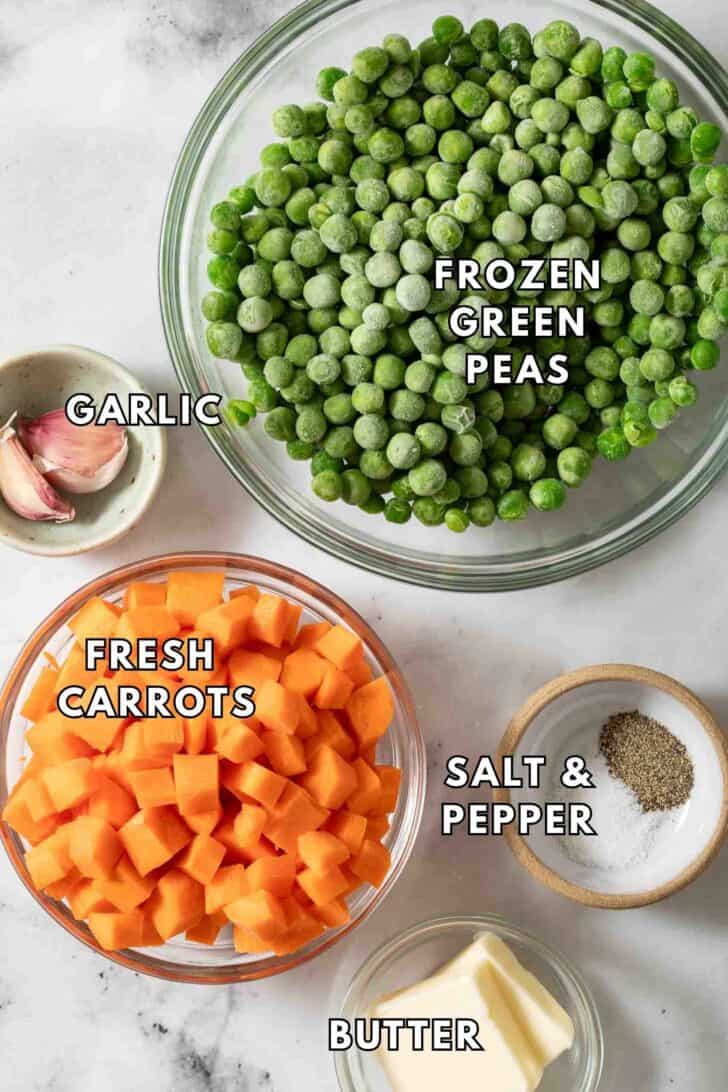 Peas and Carrots Recipe Clear glass bowls filled with frozen green peas and diced carrots.
