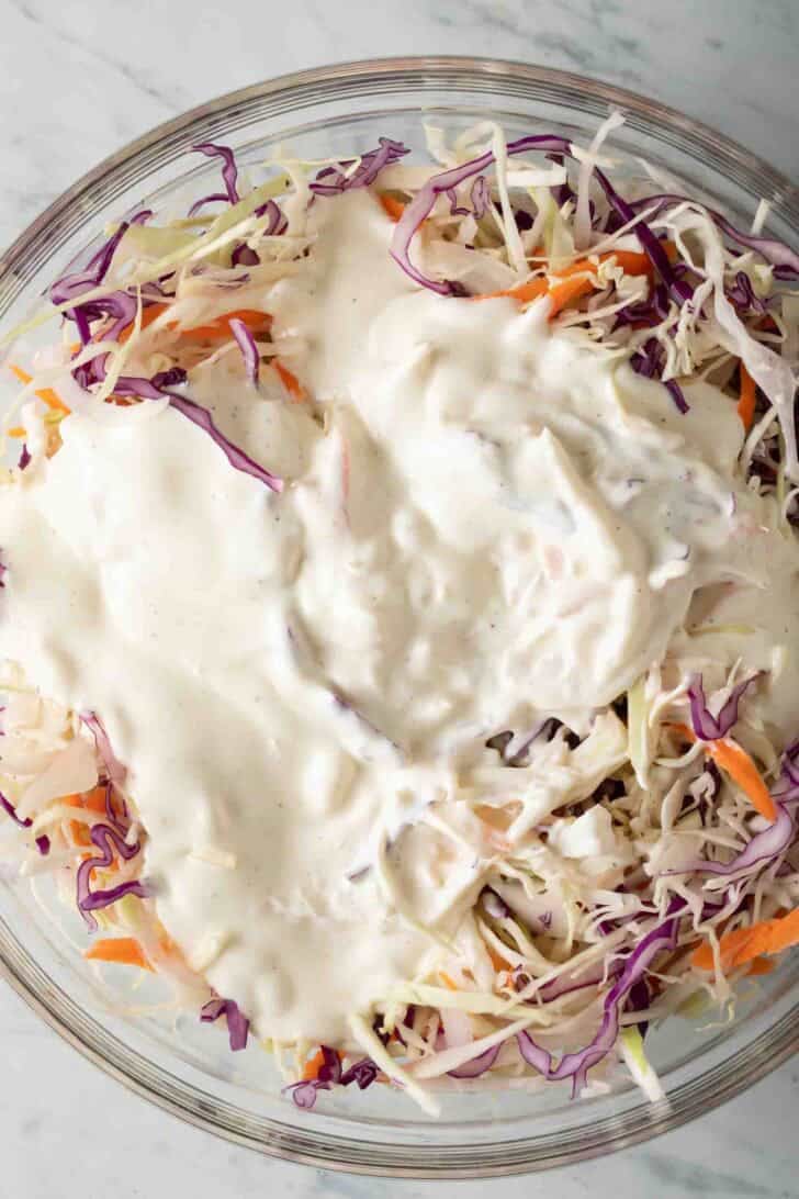 Simple Coleslaw Dressing Recipe Shredded Cabbage with a simple coleslaw dressing poured on it.