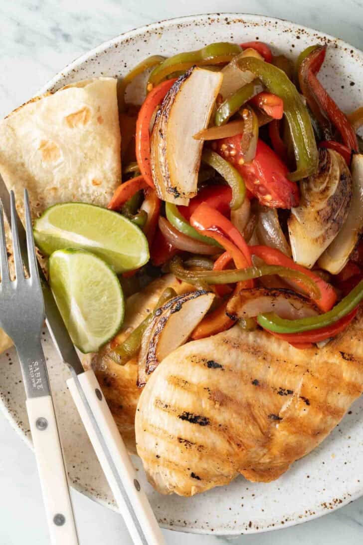 Fajita Veggies Fajita Veggies on a plate with grilled chicken.