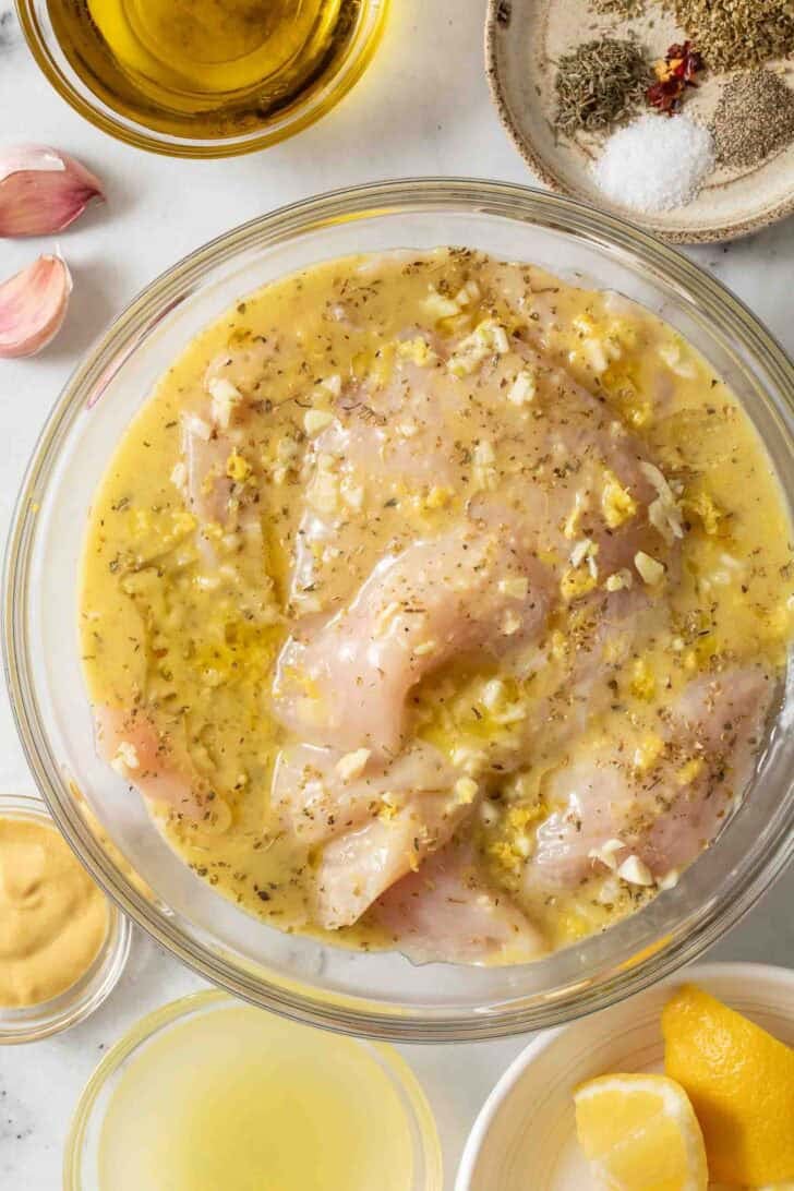 Lemon Garlic Chicken Marinade Lemon Garlic Chicken Marinade in a clear glass bowl.