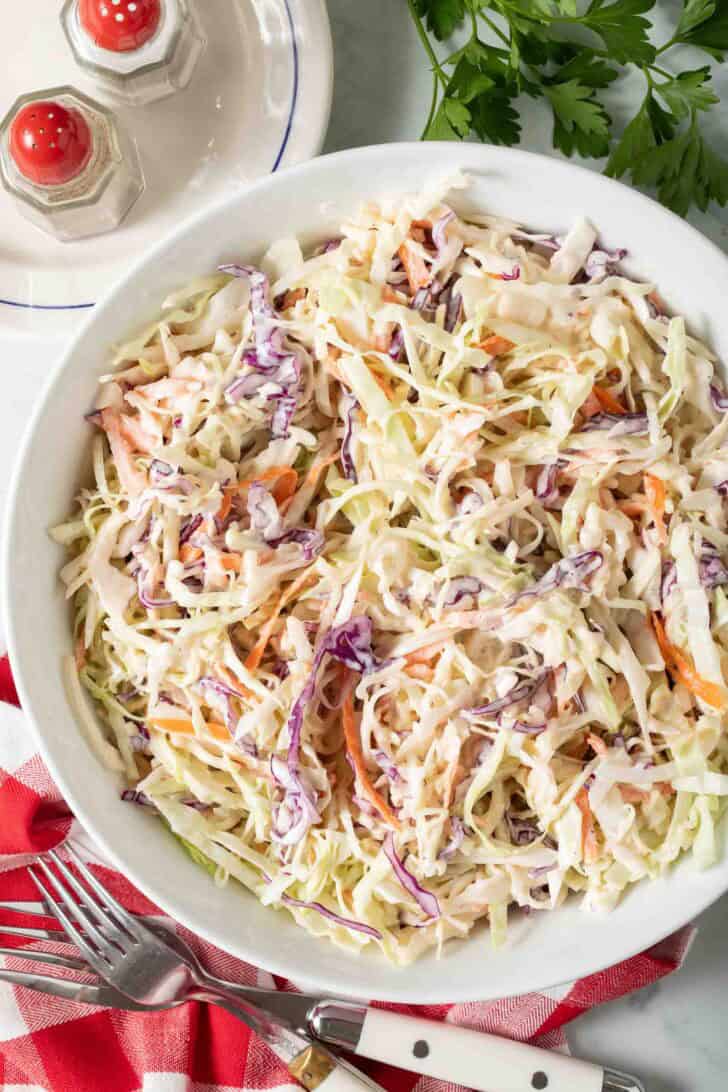 Recipe for Basic Coleslaw Easy homemade coleslaw in a white bowl.