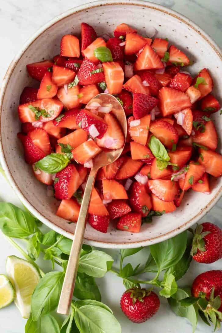 Strawberry Jalapeno Salsa Strawberry Jalapeno Salsa in a bowl with a spoon.