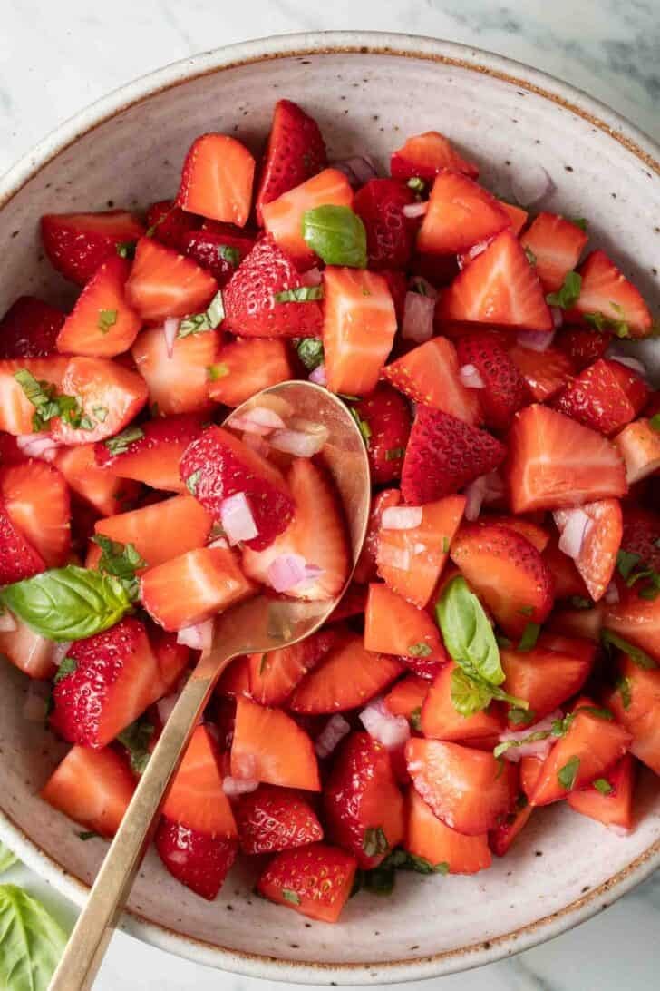 Strawberry Salsa Strawberry Salsa in a bowl with a serving spoon.