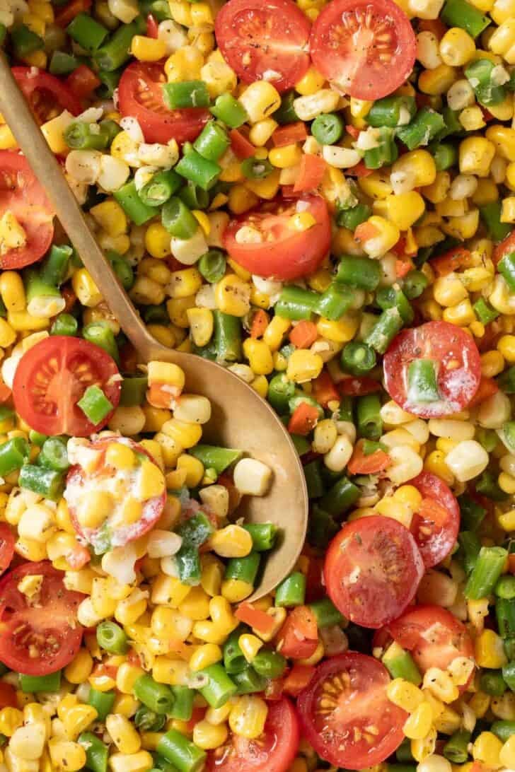 Succotash Succotash in a skillet with a serving spoon.