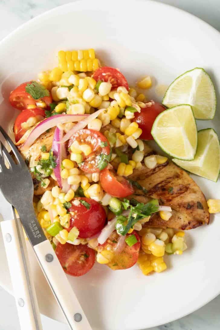 Cilantro Lime Chicken Cilantro Lime Chicken on a white plate with corn salad.
