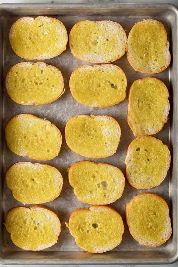 How to Make Bruschetta Baguette slices brushed with garlic oil.