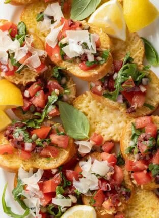 Italian Tomato Bruschetta on a white serving dish.