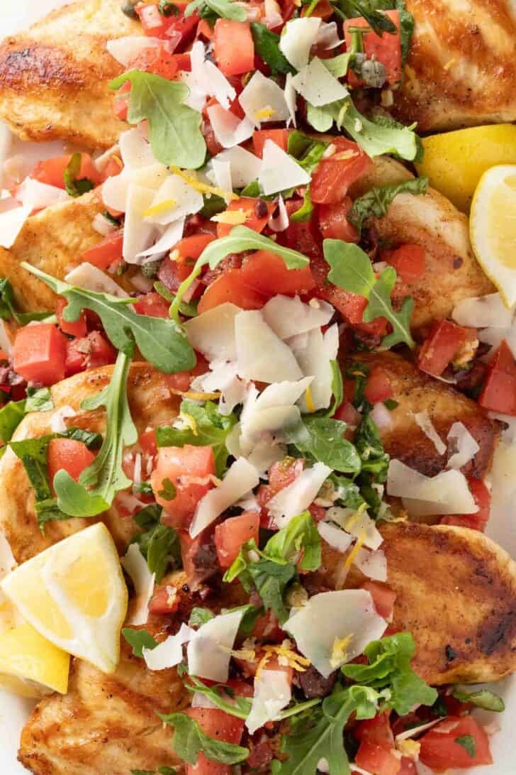 Bruschetta Chicken Grilled Bruschetta Chicken with Italian salsa spooned over it.