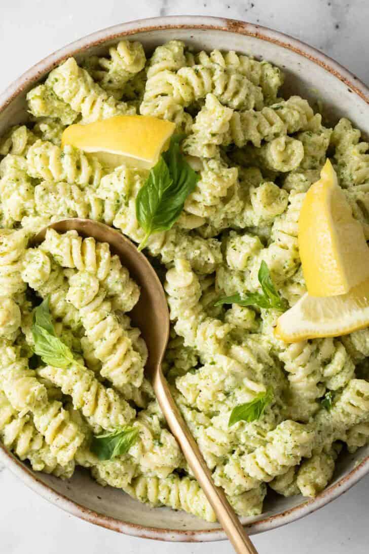 Creamy Pesto Pasta Creamy Pesto Pasta in a bowl with a serving spoon.